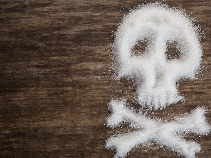 A skull made from white sugar highlights the potential dangers of this sweet, sweet powder. 