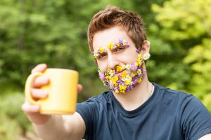 man holding cup of english breakfast tea in yellow mug