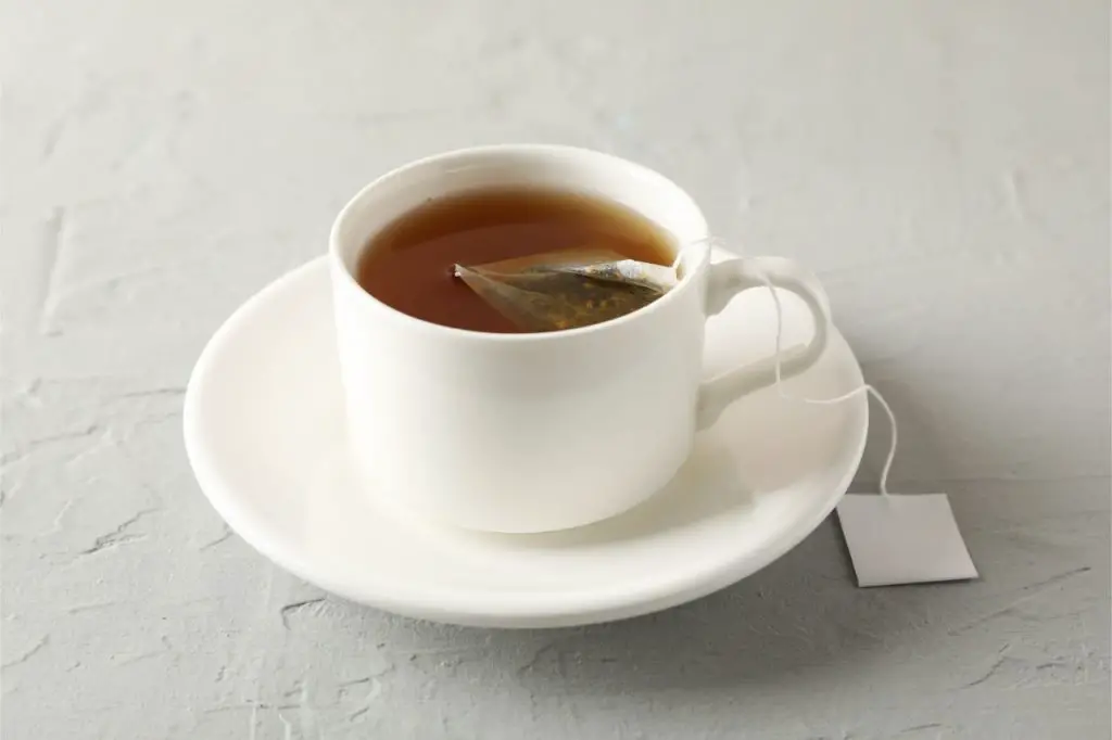 tea bag brewing in a cup