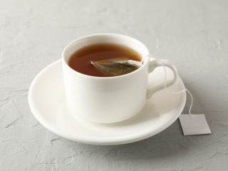 tea bag brewing in a cup