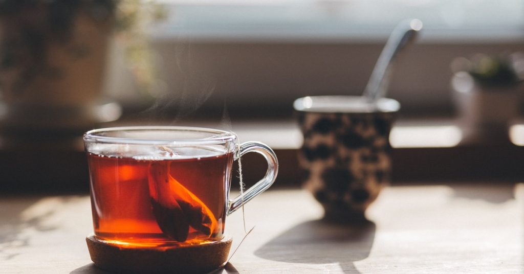 a cup of tea with a tea bag inside