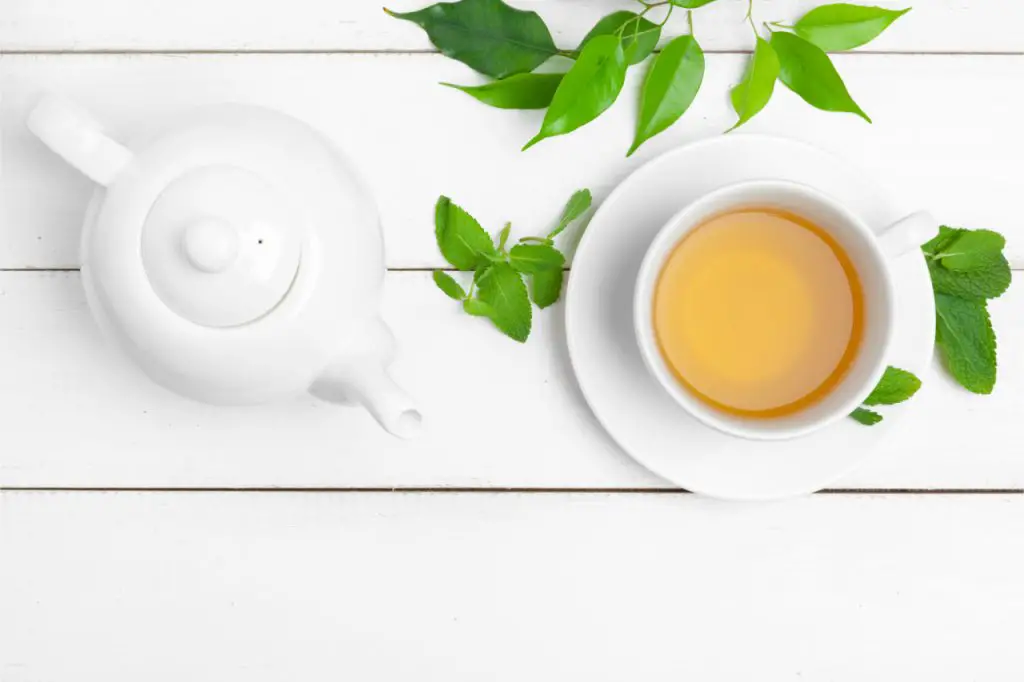 tea pot and cup of white tea