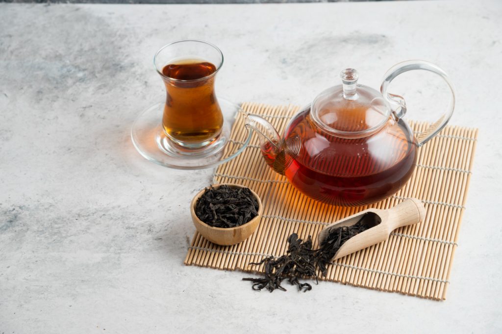 glass tea pot with loose tea leaves