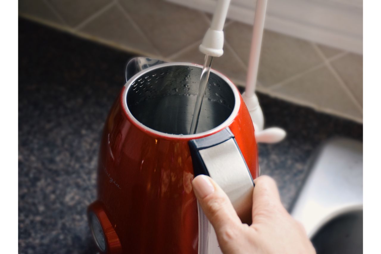 filling tea kettle with water