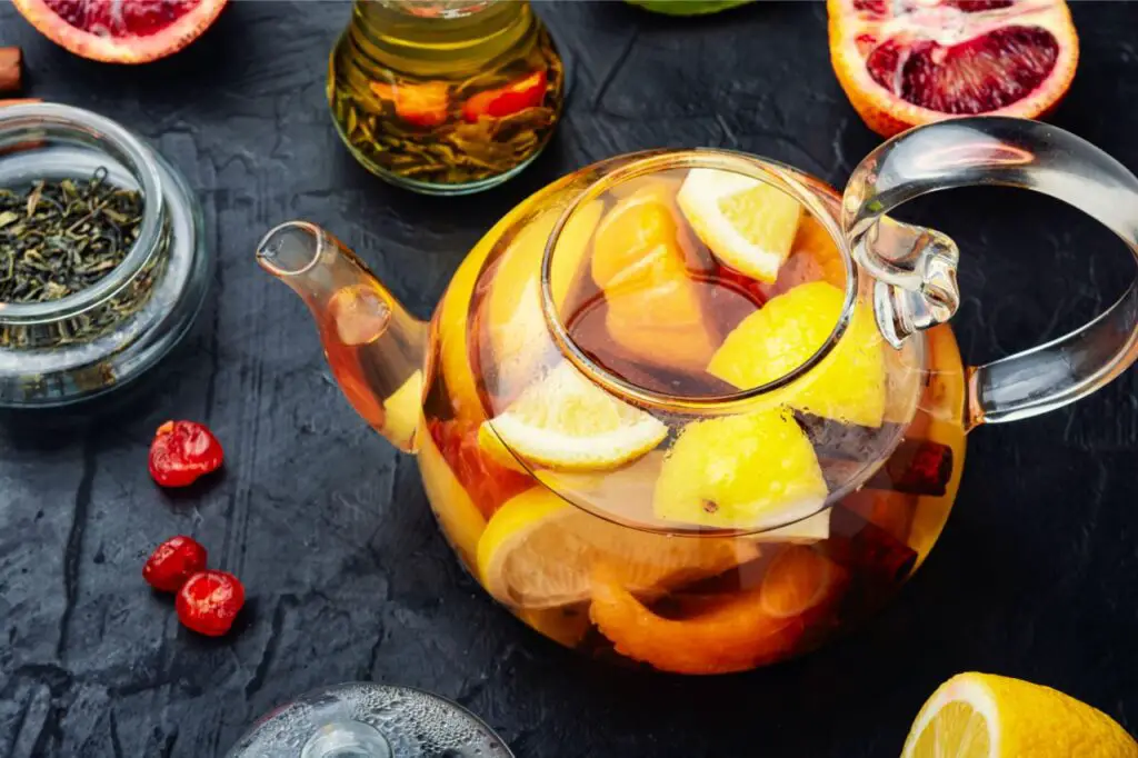 glass tea kettle with fruits