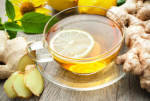 ginger tea in glass cup with lemon